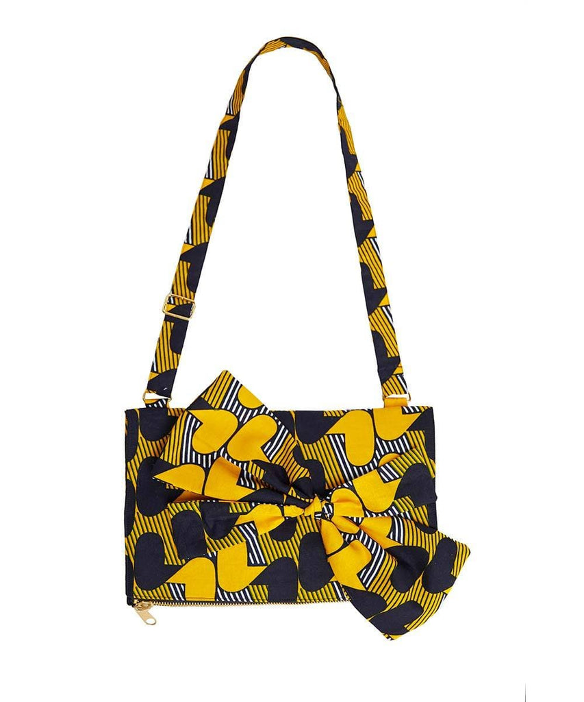 Goldenrod with blue and white print Ankara fabric. Adjustable shoulder stripes.
